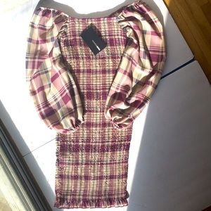Fashion Nova’s Casually Waiting Smocked Mini Dress
